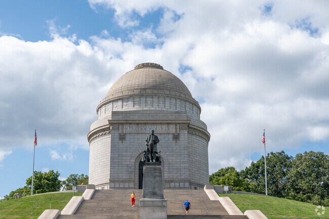 Residents of McKinley Fork Northwest walk the steps at the McKinley Monument.