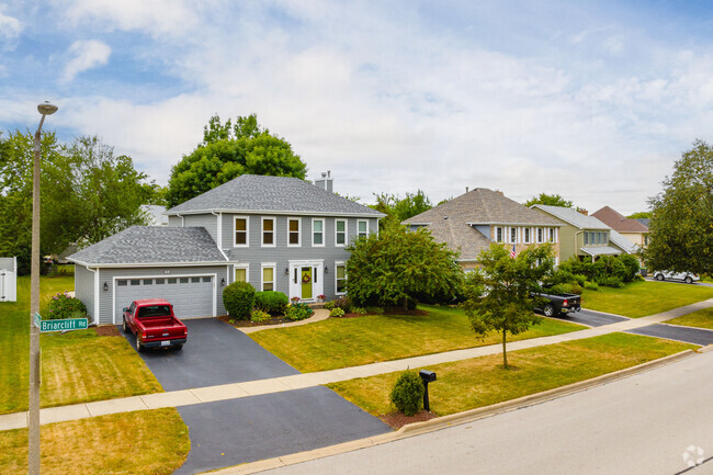 Homes in Briarcliff Woods feature multicar garages and trimmed lawns.