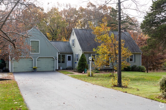 This traditional Cape Cod has a conveniently attached garage.