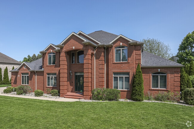 Red-brick mansions deliver more than ample square footage in Delta Township.