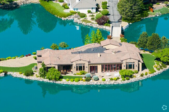 A singular luxury home is built upon its own island in Lakeridge.