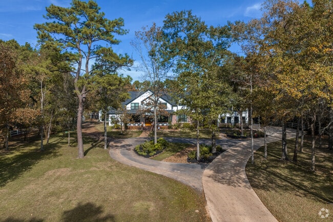 Early 2000s-era homes found in Magnolia's Indigo Lake Estates offer instant lake access.