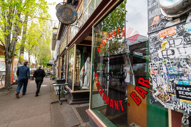 Main drag, bar and coffee shop located on a popular retail strip in Laurelhurst, Oregon.