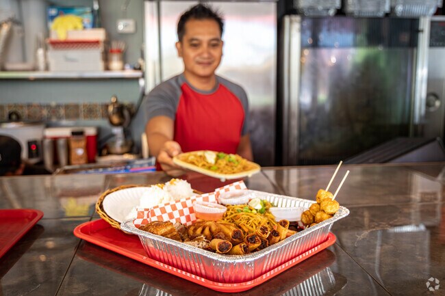 Pinoy Grill in Prospect Heights serves street food such as sweet pork buns and meat skewers.