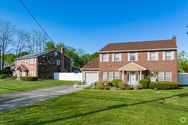 Brick-faced colonial homes in Wheatley Heights remain timeless classics.