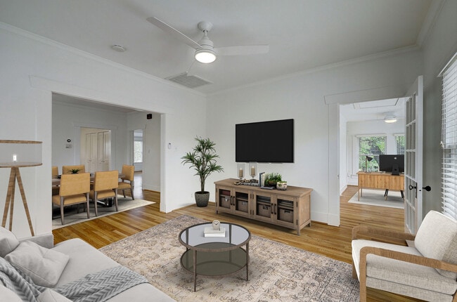 Virtually staged. View from living room of dining room and bonus study.