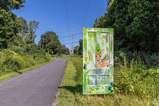 Door mural along a walking trail in Downtown Wayland, minutes from in the Wayland neighborhood.