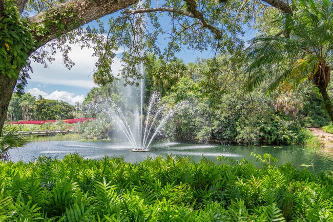 Fountain surrounded by trees and shrubs adds serenity to Addison Reserve.
