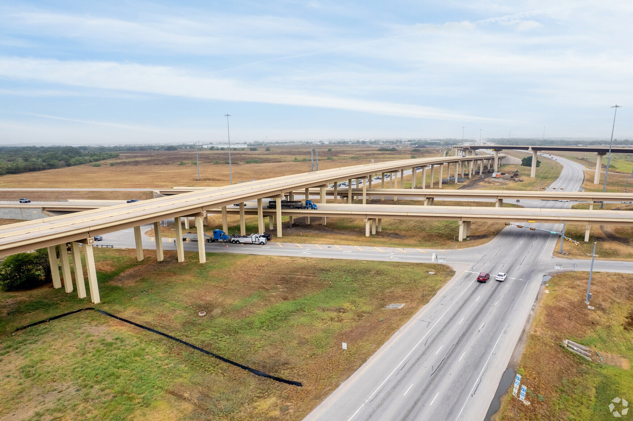 The I30 Toll & Highway 71 intersect just between Del Valle & Garfield Neighborhoods.