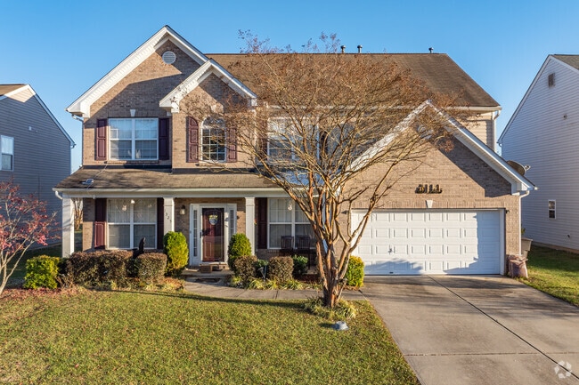 In Squire Davis, a New Traditional home showcases a beautifully manicured lawn.