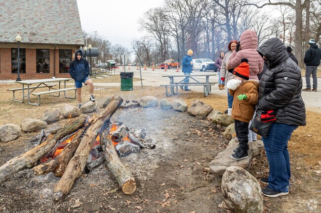 Trenton residents enjoy seasonal activities around a large bonfire at Winter Wonderland.