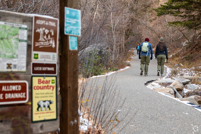 A hiker enjoys views of varied terrains in Outlying Salt Lake County.