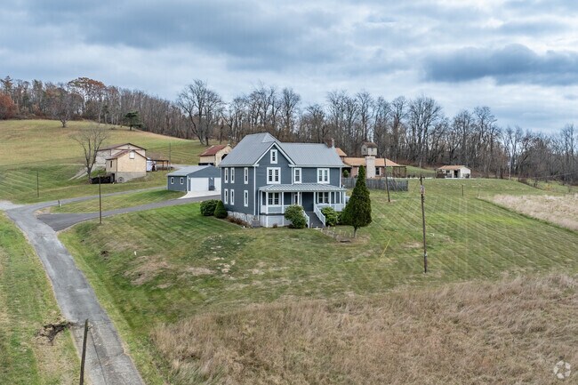 Large farm houses can be found in the rolling hills of Smith Township.
