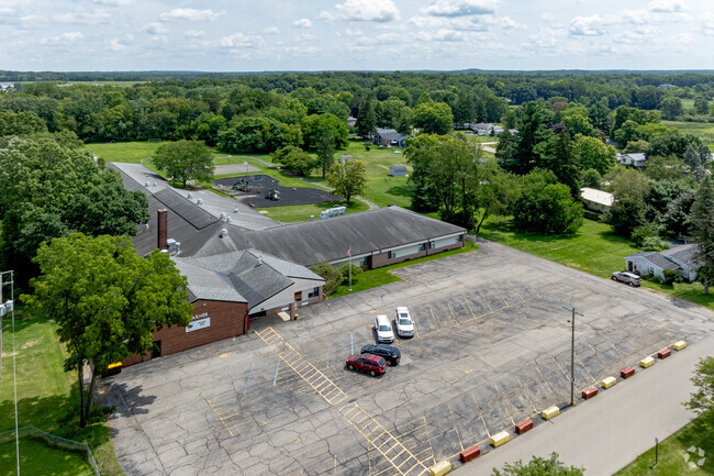 A wide parking lot has plenty of space for visiting parents at Warner Elementary School.