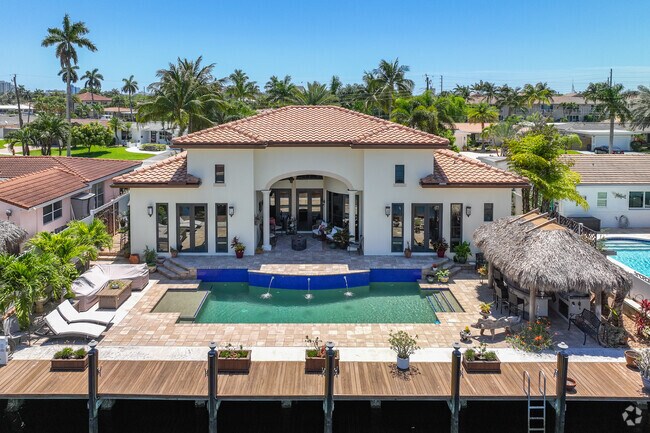 Spanish revival multilevel waterfront property in the Cypress Harbor neighborhood