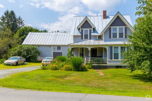 Typical gabled farmhouses with metal roofs can be found in Royalton.