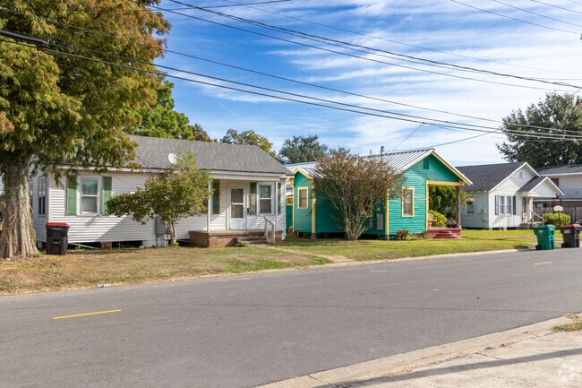 Bungalow-style homes shaded by large trees sit along the streets of Freetown-Port Rico.