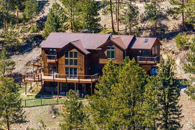 Log cabin-inspired custom homes can reach as high as $1.8 million in Evergreen Heights and Estates.