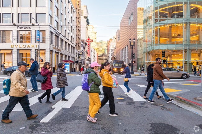 Pedestrians fill the street after work in Union Square in Downtown San Francisco.