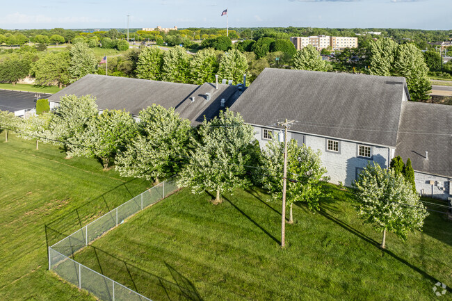 A fenced activity area can be found behind WSC Academy.