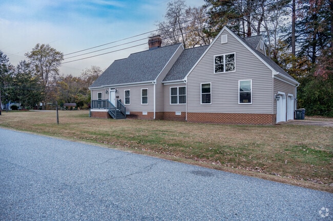 A Cape Cod inspired build sits in a quiet street