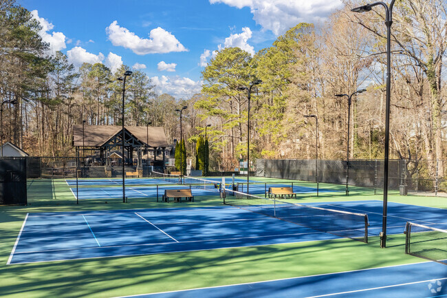 The Branches private neighborhood club features four lighted tennis courts that host a variety of community events.