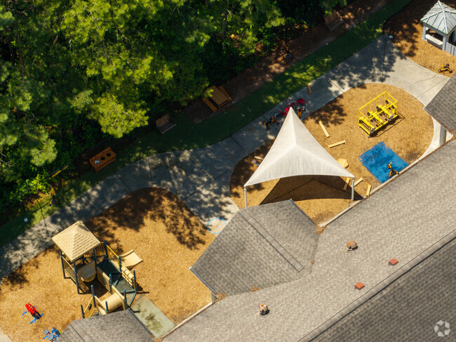 Guidepost Montessori at Deerfield has a playground that has covered areas.