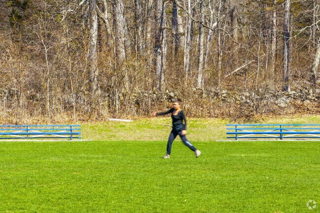 A woman practices ultimate frisbee on a soccer field in Lisbon Meadows Park.