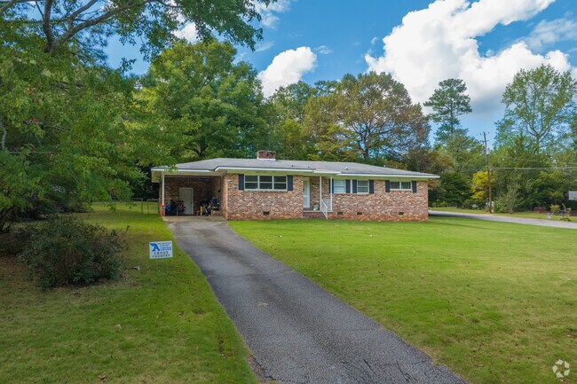 Ranch style homes in Cary Woods often feature long driveways.