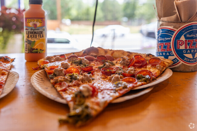 Central Boulder offers mouthwatering pizza slices perfect for a quick, satisfying meal.