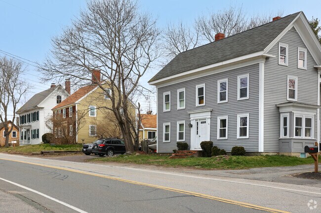 Large colonial homes reach out to the street in Essex.