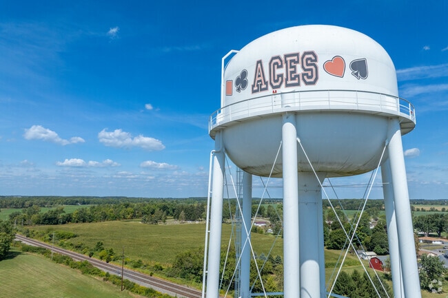Aces water tower stands as a landmark in Hicksville near the school campus.