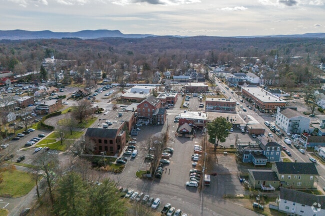 Looking across downtown Florence  in this aerial view shows some mountains in the distance.