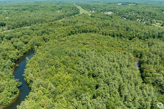 Hawkes Preserve is encircled by the Presumpscot River, offering scenic trails and kayak access.