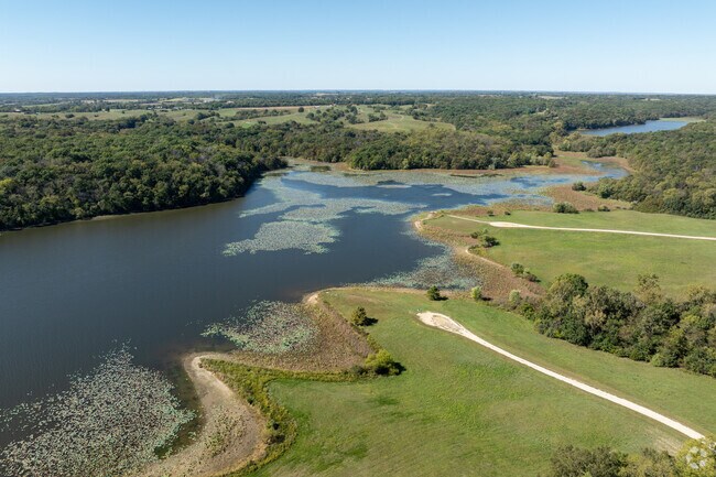 Trails loop D.C. Rogers Lake beside RV and tent camping.