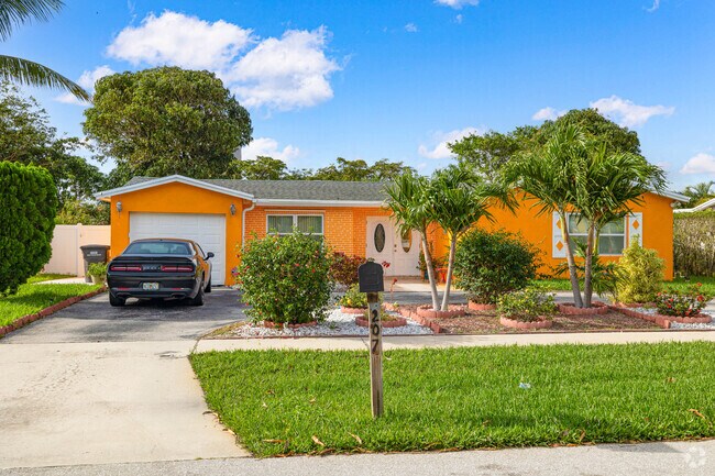 A classic Floridian colorful ranch in Palm Beach Lakes South.