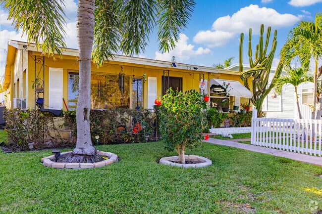 Serene ranch home in Bryant Park embraced by diverse foliage.