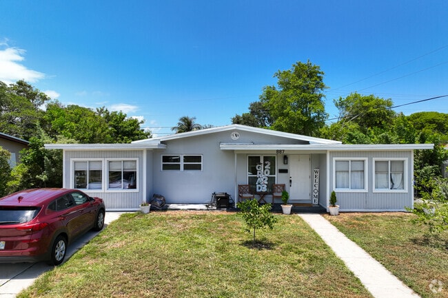 Traditional single family home in Ocean Breeze neighborhood.