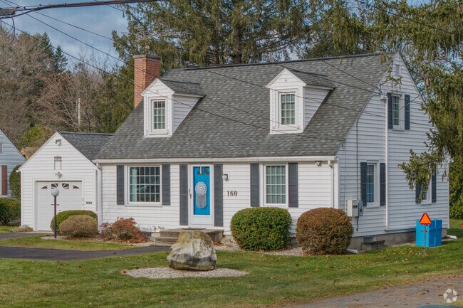 This traditional cape home in Leeds is a prime example of a nice home on a good-sized lot.