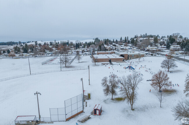 Salnave Elementary has a large baseball field behind the school.