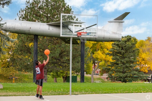 A visitor plays basketball at Belleview-Cornerstone Park in front of the iconic missle.