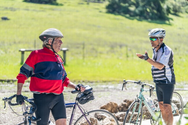 A couple of cyclists at Santa Teresa County Park discuss the health benefits of riding bikes.