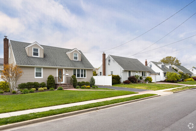 On some of the streets in Plainedge, NY you will see rows of cape cod-style homes.