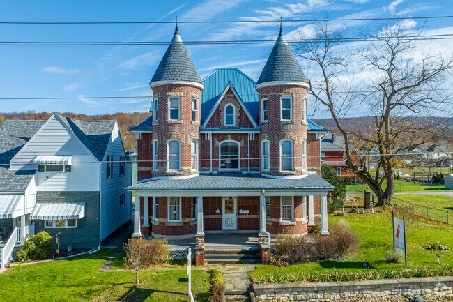 Gothic architecture with built in towers have 3 stories of living space in Connellsville.