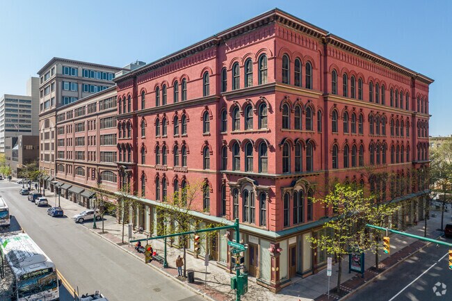 Colorful mixed-use buildings adorn the streets of Downtown Syracuse.