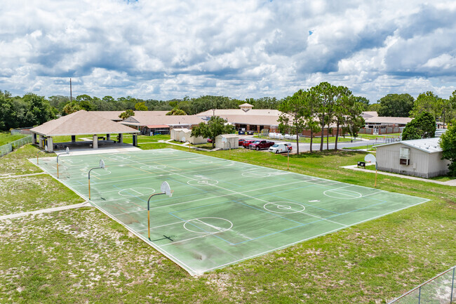 Students enjoy outdoor play on the sports courts at Fox Hollow Elementary.