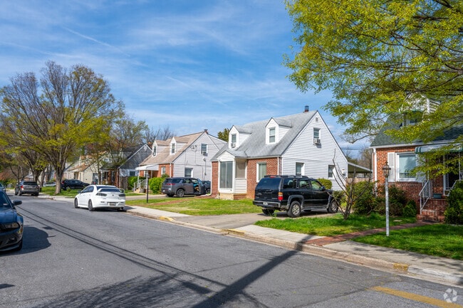 A row of brick Cape Cod homes on 37th St in Brentwood.