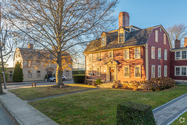 Classic Colonials and historically protected properties line the Lily-Almy Pond streets.