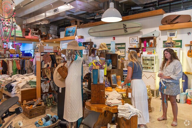 Inside Pineapple Park's Gypsy Life Surf Shop, a paradise for beach lovers.