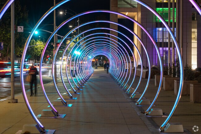 Sun neighborhood enjoys the vibrant Sonic Runway in downtown San Jose at night.